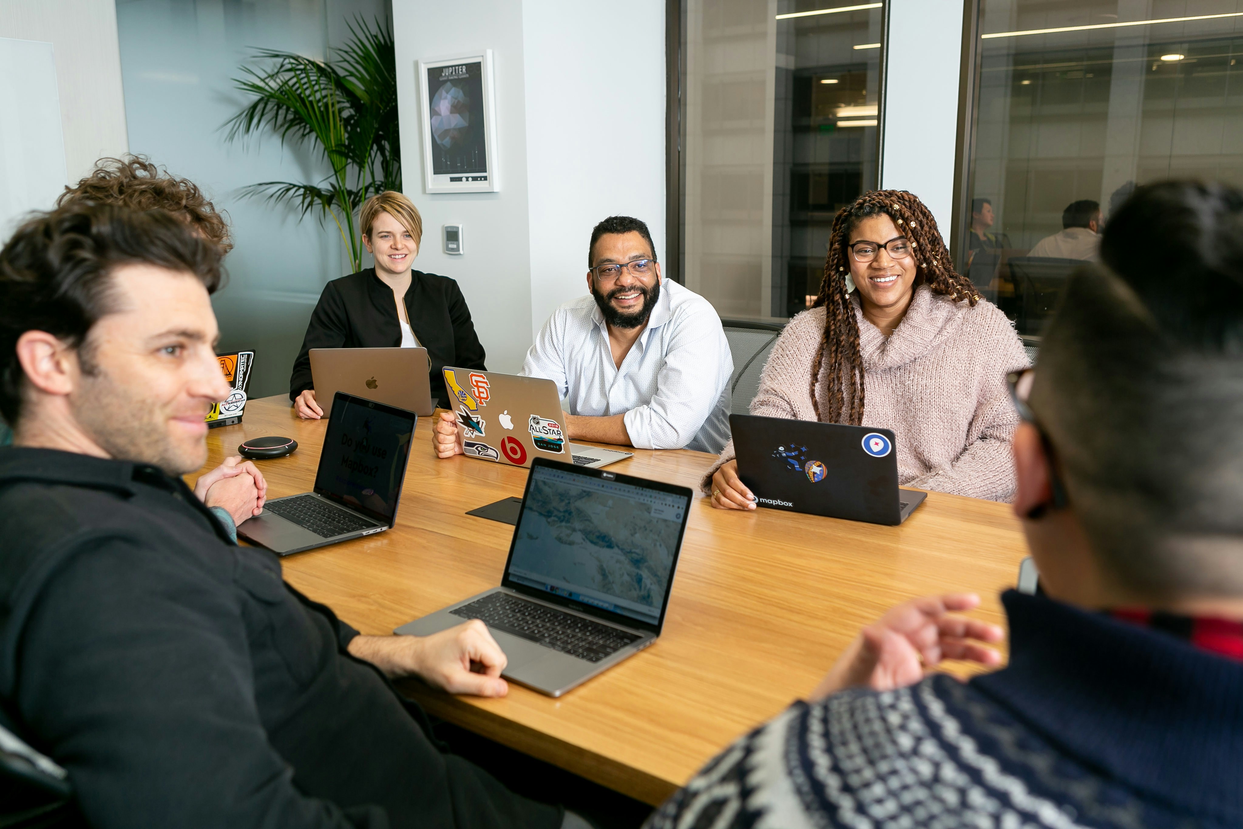 Team collaborating on business automation - Photo by Mapbox on Unsplash